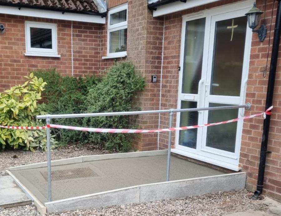 Work near completion on an accessible entrance ramp